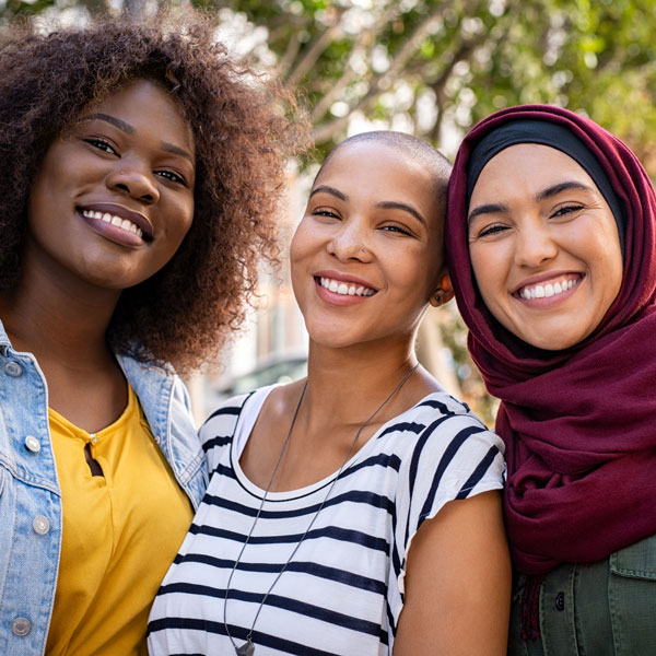 three friends smiling