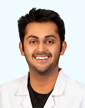 Dr Shah smiling